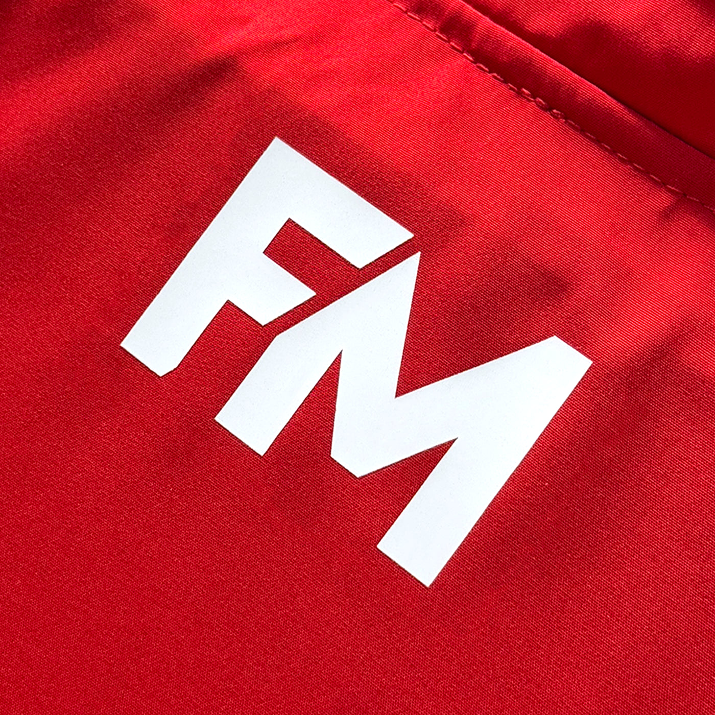 Silicone FM logo applied to raincoat